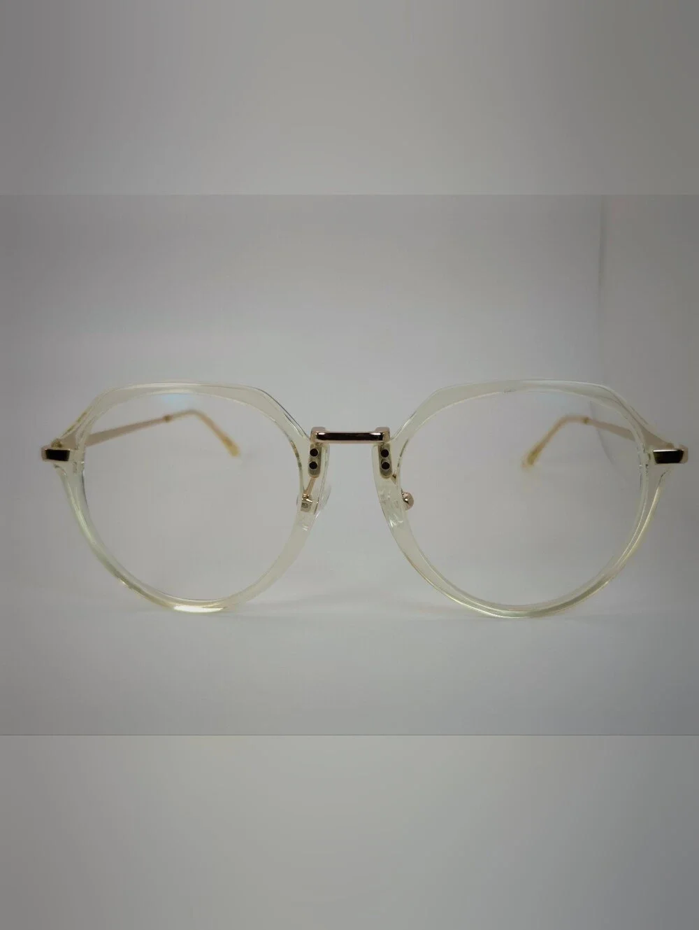 Tamara. Clear Round Frame Glasses with Gold Accents. Nose Pads. Metal Bridge